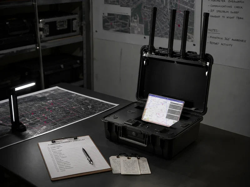 UPL1-B briefcase-style drone locator at a generic command handoff table