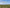 UG25 in exact front-left reference orientation above an empty geometric orchard research plot, neutral daylight