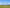 UG21 in the exact frontal reference view above an empty broad grass drainage swale, low distant hills and clear daylight, tiny magenta survey flag far below