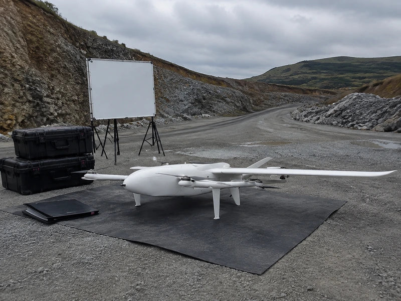 Complete UG25 fixed-wing VTOL during a multi-site mapping handover review